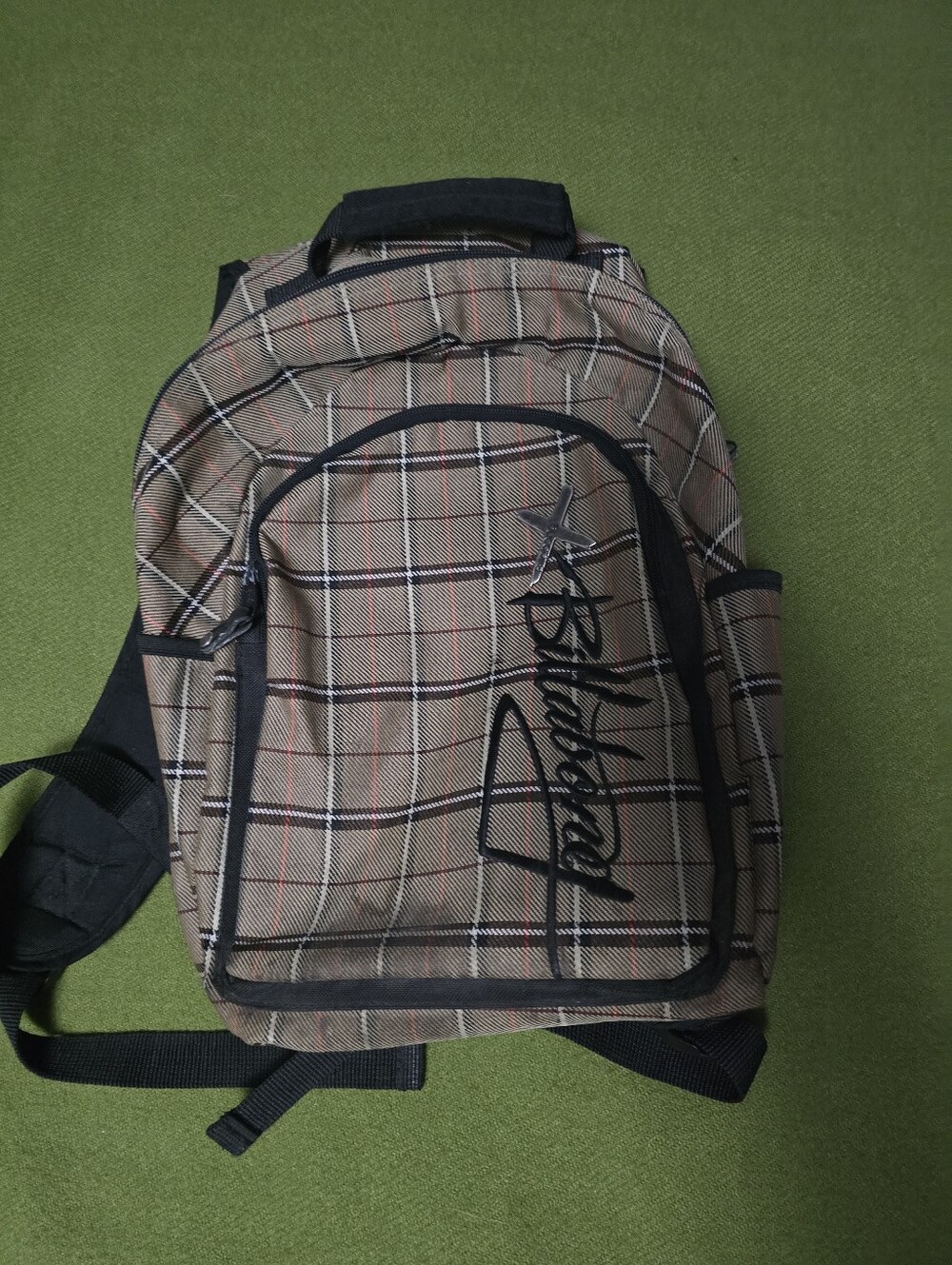 Vintage Billabong plaid backpack features a classic brown tartan pattern